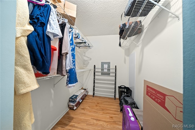 walk in closet featuring hardwood / wood-style flooring