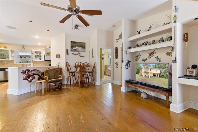 interior space featuring ceiling fan and light hardwood / wood-style floors