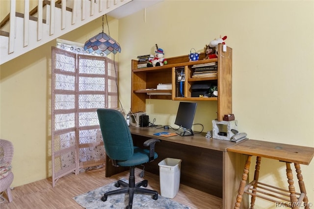 office with light hardwood / wood-style flooring