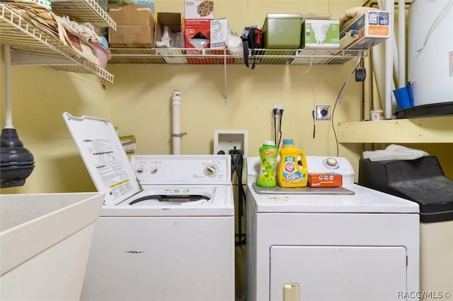 laundry room featuring separate washer and dryer and sink