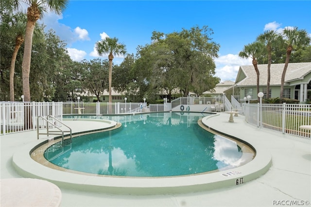 view of swimming pool featuring a patio