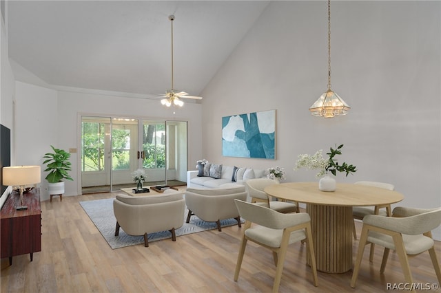 living room featuring ceiling fan, high vaulted ceiling, and light hardwood / wood-style floors