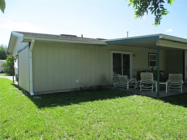 back of house with a yard