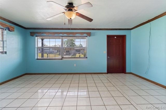 tiled spare room with ceiling fan and crown molding