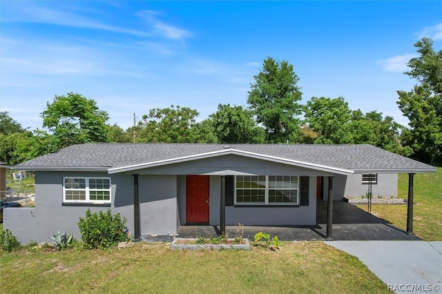 ranch-style home with a front lawn and a carport