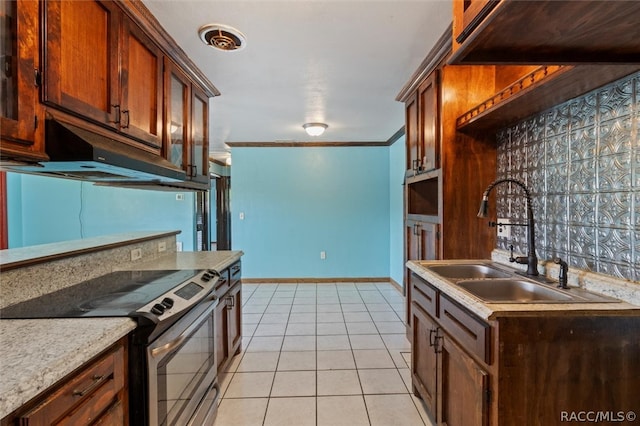 kitchen featuring stainless steel electric range, light tile patterned flooring, ornamental molding, and sink