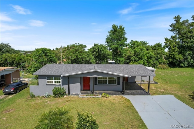 ranch-style house with a front yard and a carport