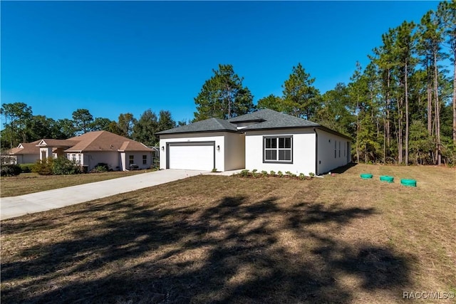 view of front facade featuring a front lawn and a garage