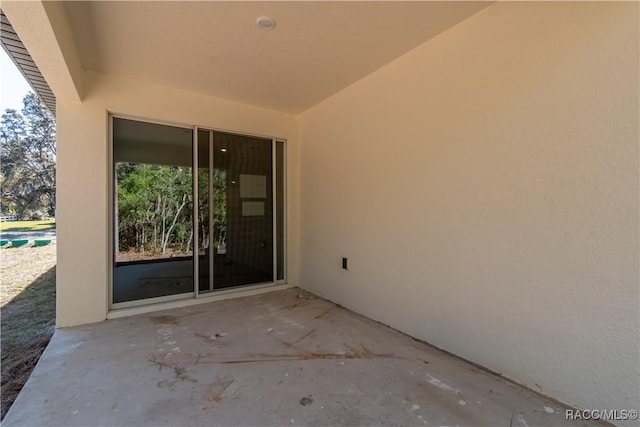 property entrance featuring a patio