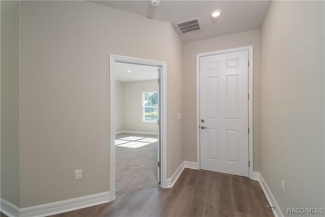 corridor featuring hardwood / wood-style flooring