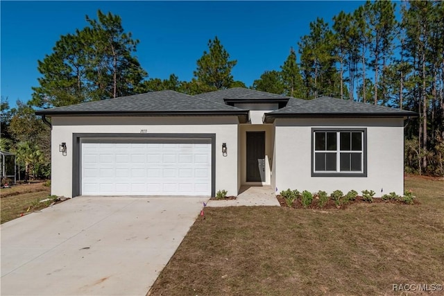 view of front of house with a front lawn and a garage