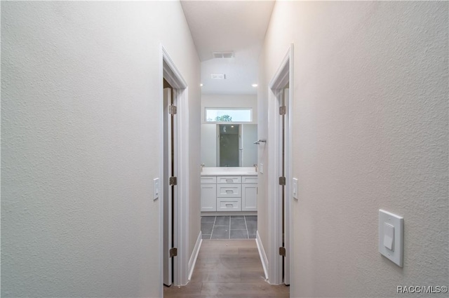 hallway featuring wood-type flooring