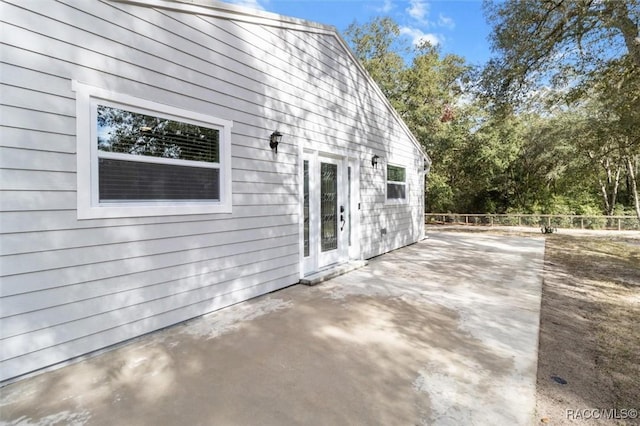 view of side of property featuring a patio