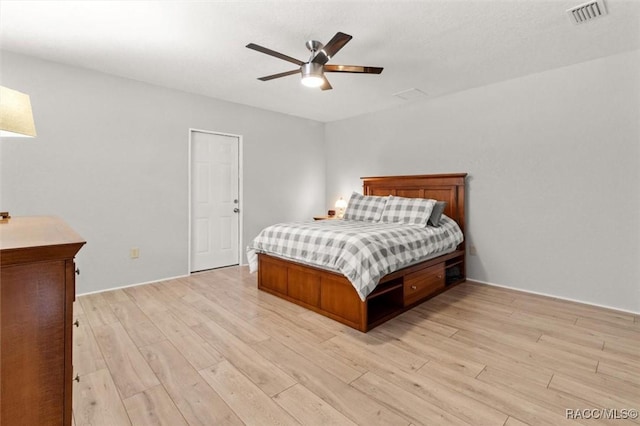 bedroom with ceiling fan and light wood-type flooring