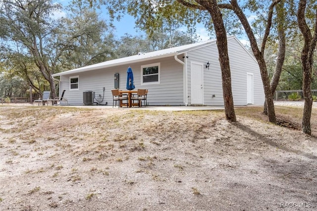 back of house with a patio area and cooling unit