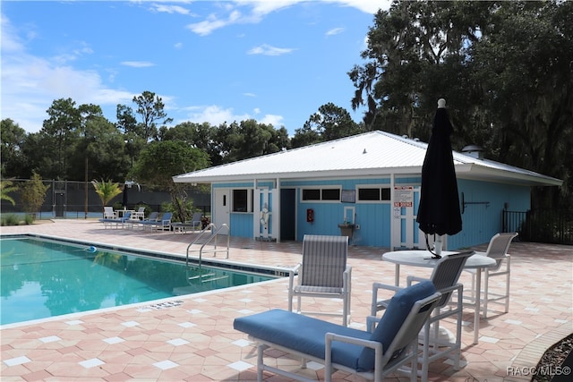 view of swimming pool featuring a patio area