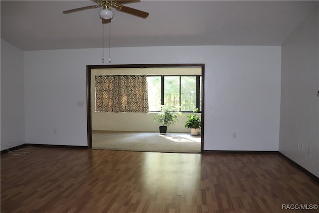 unfurnished room with ceiling fan and dark hardwood / wood-style floors