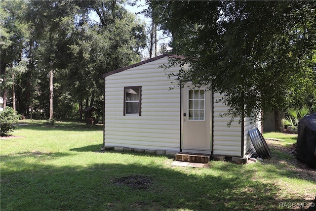 view of outdoor structure with a yard