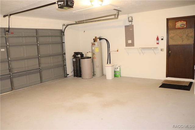 garage featuring electric panel, a garage door opener, and water heater