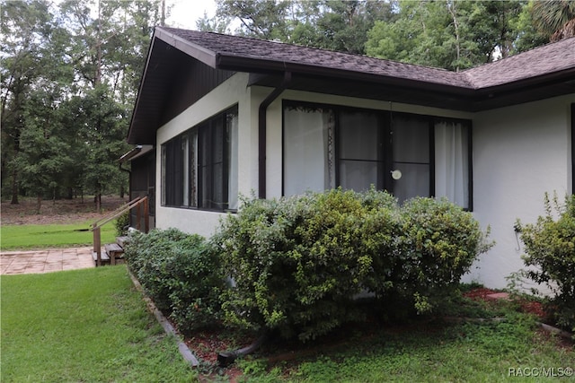 view of home's exterior featuring a lawn