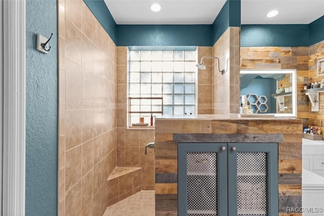 bathroom with a tile shower