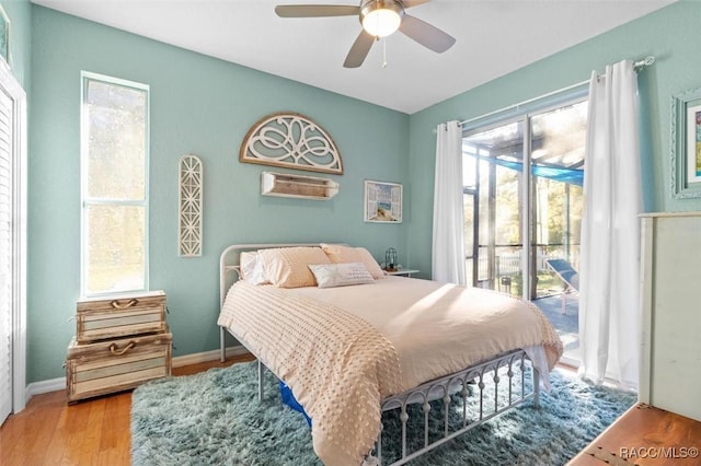 bedroom with ceiling fan, access to exterior, and light wood-type flooring