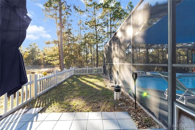 view of yard featuring a fenced in pool and a patio