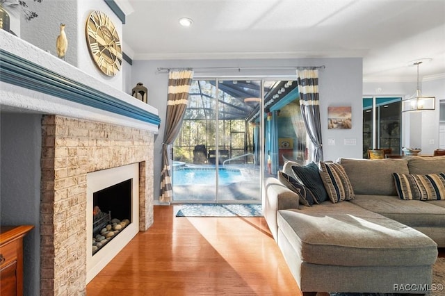 living room featuring wood-type flooring and ornamental molding