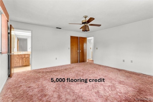 carpeted empty room with ceiling fan