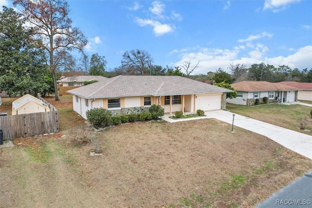 ranch-style house with a garage and a front yard