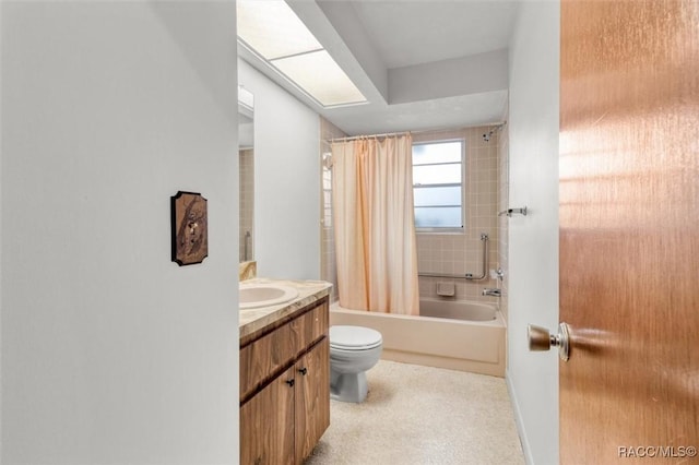 full bathroom with vanity, shower / tub combo, and toilet