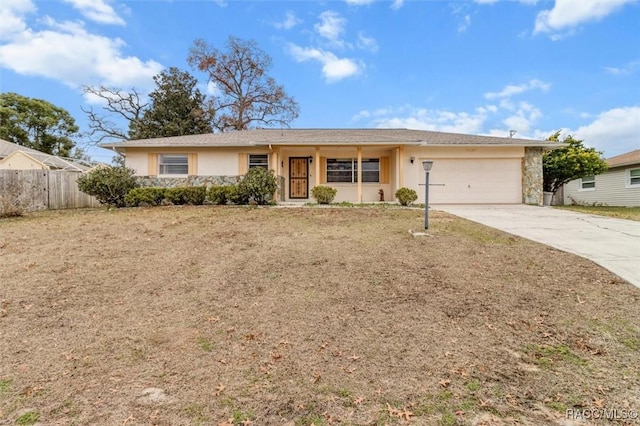 ranch-style house featuring a garage and a front yard