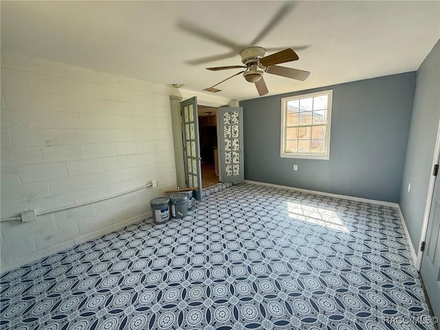 spare room with ceiling fan