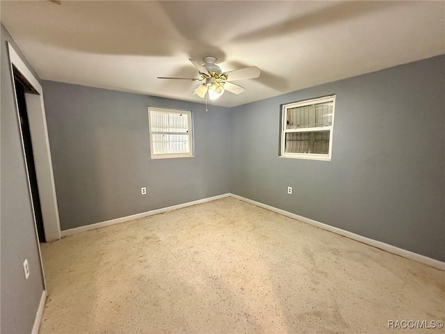 empty room featuring ceiling fan