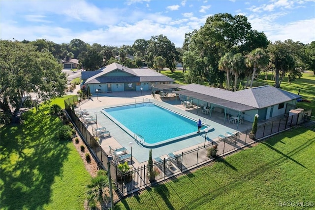 view of swimming pool with a lawn and a patio area