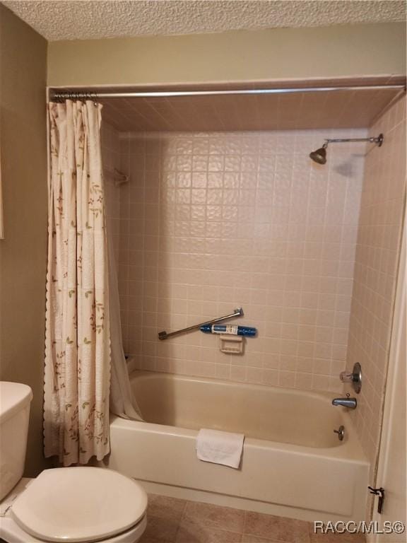 bathroom featuring tile patterned flooring, a textured ceiling, toilet, and shower / tub combo with curtain