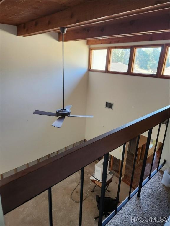 details with ceiling fan and beamed ceiling