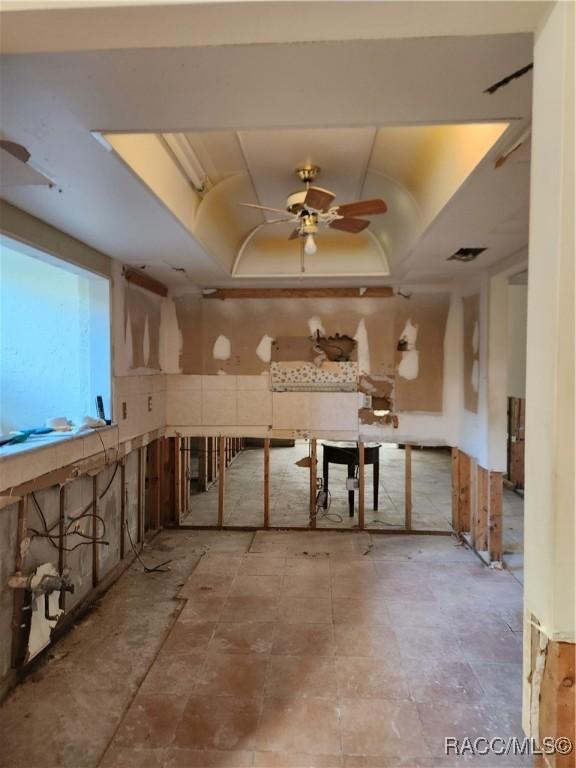 basement with ceiling fan