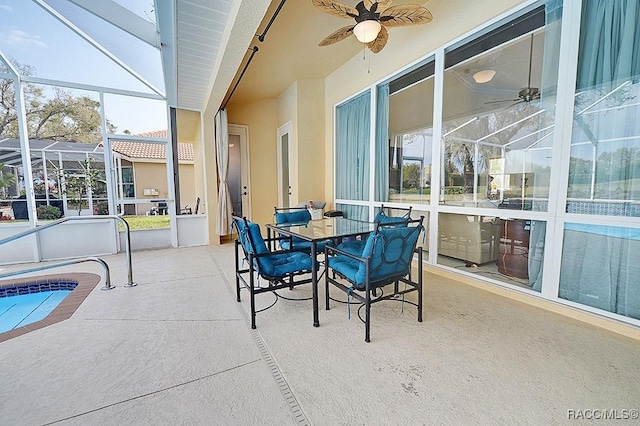 sunroom / solarium with a ceiling fan