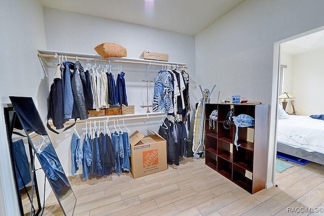 spacious closet with wood finish floors