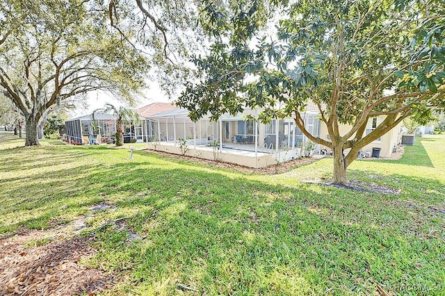 view of yard with glass enclosure