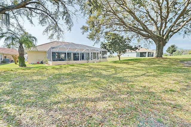 view of yard with a lanai