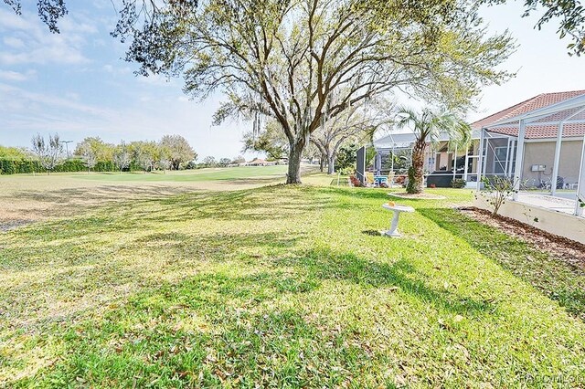 view of yard featuring a lanai