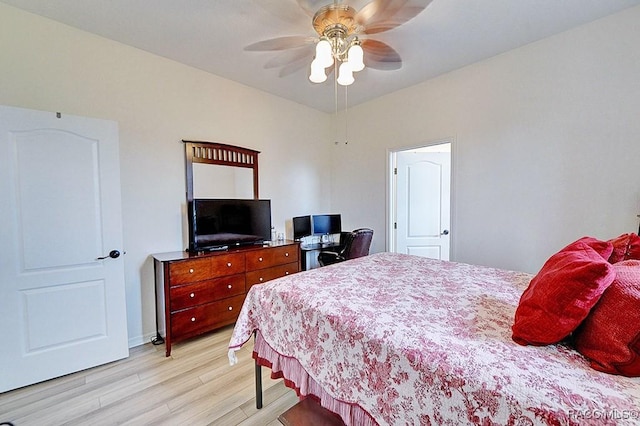 bedroom with a ceiling fan and light wood-type flooring