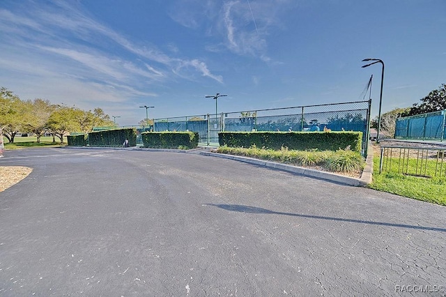 view of road featuring a gate