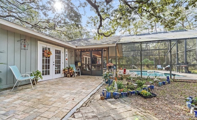 view of patio / terrace with glass enclosure and french doors