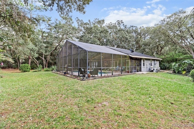 view of yard with glass enclosure