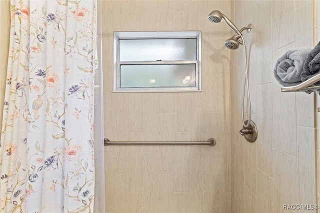 bathroom featuring a shower with curtain