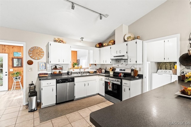 kitchen featuring sink, white cabinets, light tile patterned floors, and appliances with stainless steel finishes