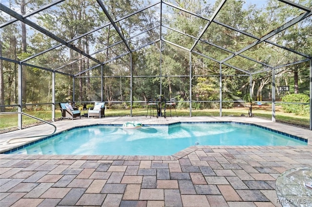 view of pool featuring a patio and a lanai